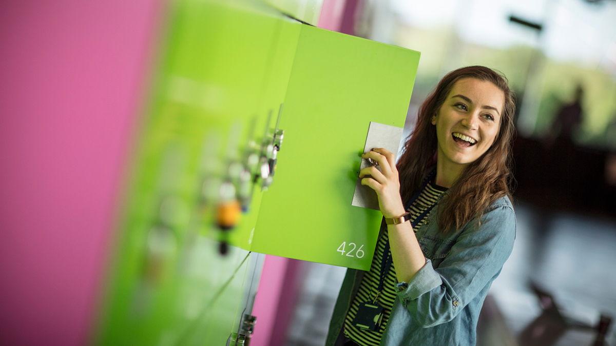 A student opening her locker