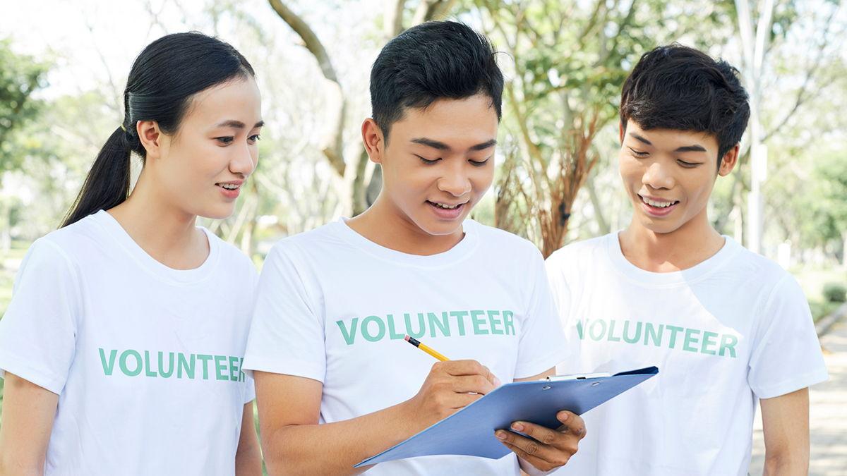 Three volunteers doing fieldwork.