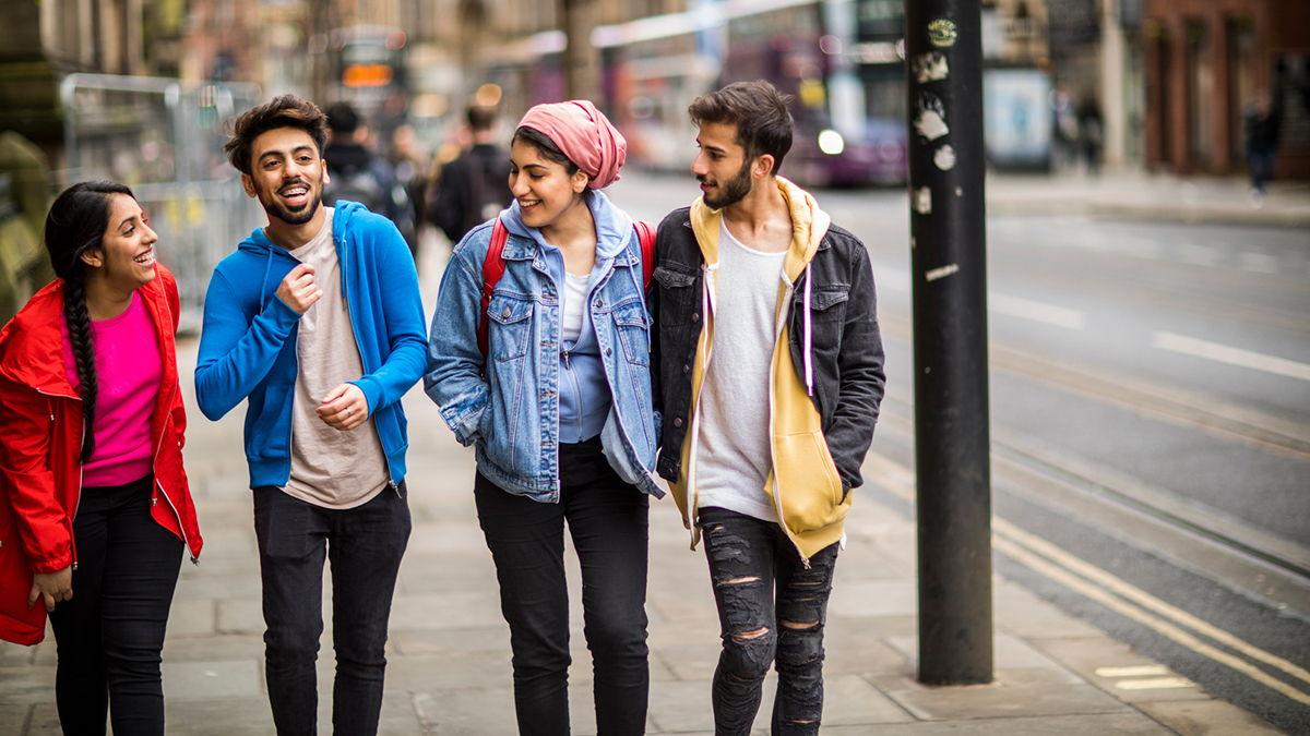 A group of students walking along a street in the UK